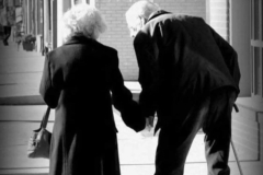 Old couple holding hands
